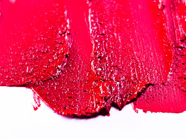 istock Red lipstick smear smudge on white, women's lips, love background, cosmetics composition, make up composition, lipstick brush strokes 1304677819