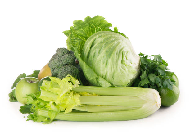 istock green fruits and vegetables on white background 1304680189