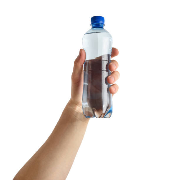 istock Hand with bottle of the water. Isolated object 1304680518
