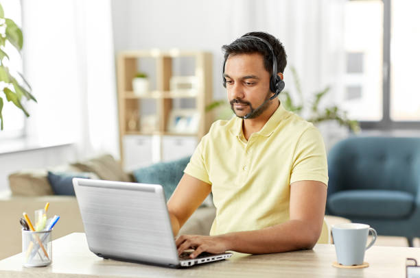 istock indian man with headset and laptop working at home 1304682085