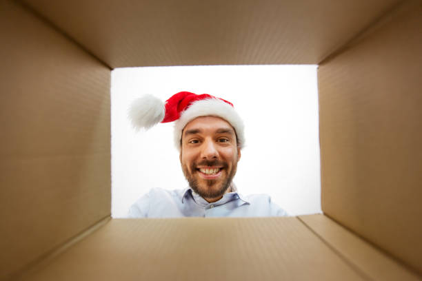 istock happy man opening parcel box or christmas gift 1304682496