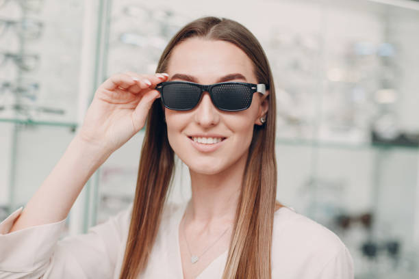 istock Black punched eyeglasses for vision training. perforated glasses trainer 1304683245