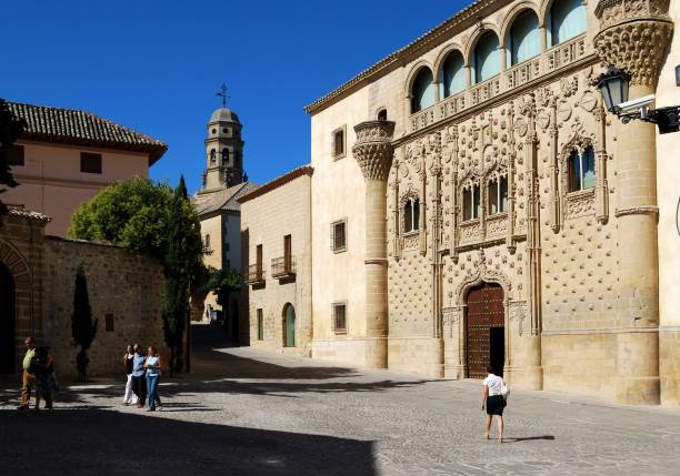 View of Jabalquinto Palace with the cathedral bell tower to the rear, Baeza, Jaen Province, Andalucia, Spain, Western Europe.