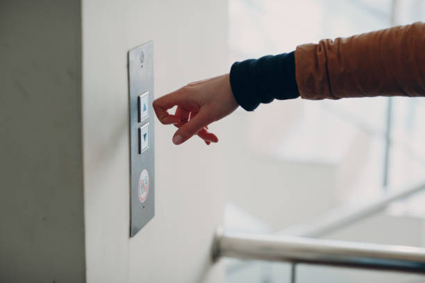 istock Close up of forefinger knuckle pressing the button elevator during coronavirus pandemic covid-19 quarantine concept 1304684896