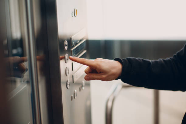 istock Close up of forefinger pressing the button elevator during coronavirus pandemic covid-19 quarantine concept 1304684907