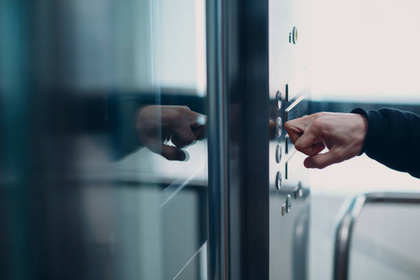 istock Close up of forefinger knuckle pressing the button elevator during coronavirus pandemic covid-19 quarantine concept 1304684908