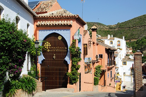Hotel and restaurant along a village street, Benahavis, Spain.