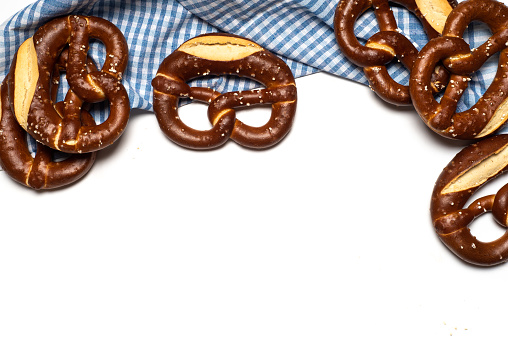 Bunch of German bread pretzels on a white background cut out