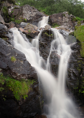 Water cascading over a waterfall in the Trossachs National Park, to the north of Loch Lomond.