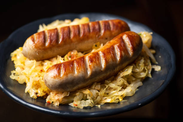 istock Bavarian sausages served with sauerkraut on a plate 1304687367