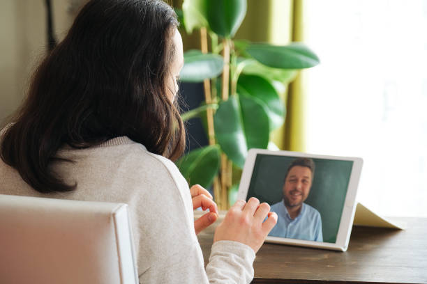 istock Happy family talking within video call on digital tablet 1304687972