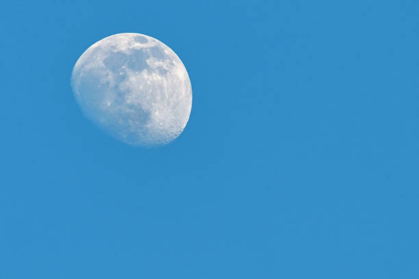 istock Large White Moon On A Clear Blue Sky Without Clouds 1304688117