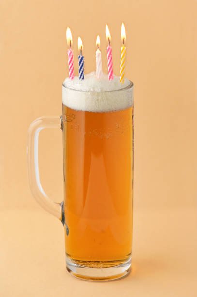 Conceptual Closeup Pint Of Beer Birthday With Candles stock photo