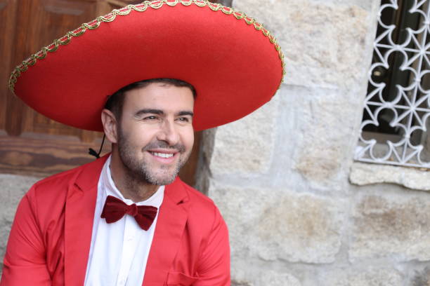 istock Traditional mexican man with elegant red outfit 1304689613