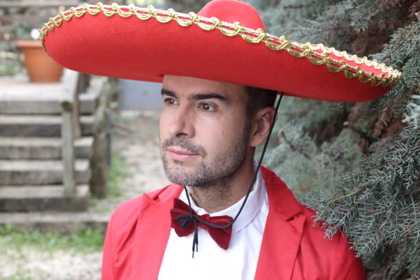 istock Traditional mexican man with elegant red outfit 1304689718