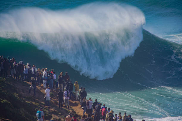 Liquid avalanche One of the most perfect days Nazare in Portugal has seen in 2020. nazare surf stock pictures, royalty-free photos & images