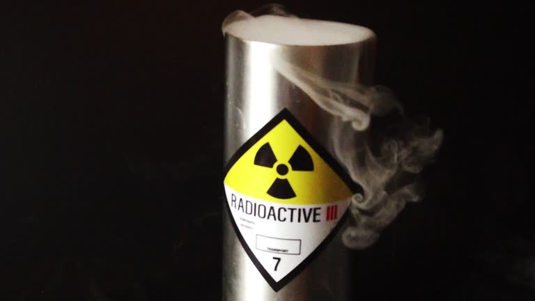 Slow motion radioactive canister with smoke billowing out panning