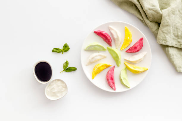 istock Steamed dumplings tio view. Vegetables ravioli on white plate 1304695936