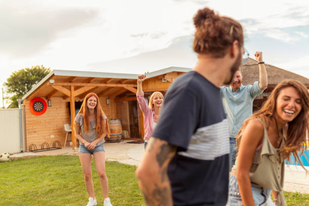 istock Friends having a sack race in the backyard 1304696529