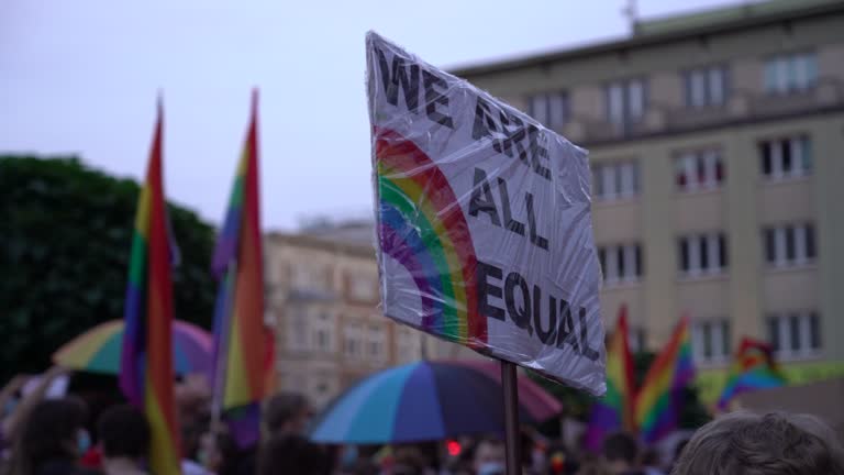 LGBT equality march. Fight for LGBTQ+ rights. Rainbow flags, banners and masks. Struggle for LGBT rights during coronavirus pandemic.