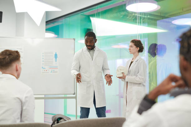 istock African American Professor Presenting at Medical Seminar 1304697621