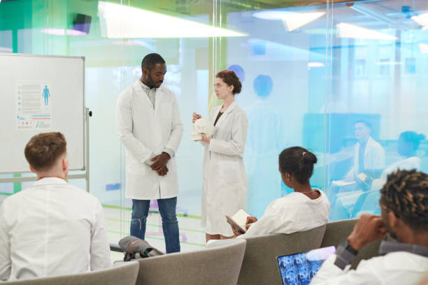 istock Two People Presenting at Medical Seminar 1304697622