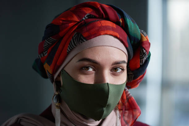 istock Muslim woman in mask 1304697661