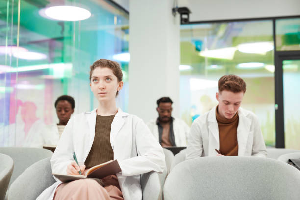 istock Group of Young Doctors at Seminar 1304697667