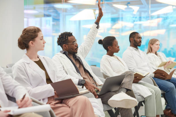 istock Multi Ethnic Group of Doctors at Medical Seminar 1304697771