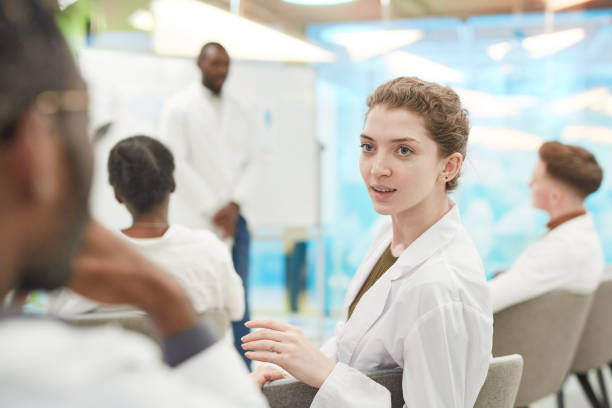 istock Female Med Student in Seminar 1304697801