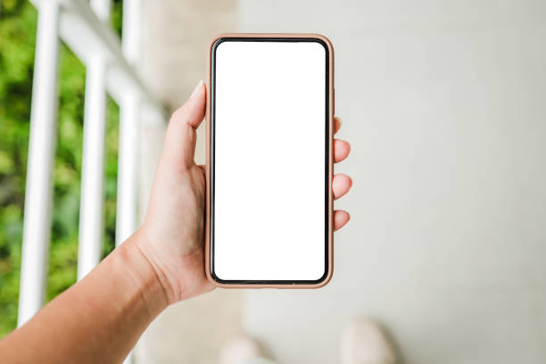 istock Women's hands holding cell telephone blank copy space screen. smart phone with technology concept 1304698526