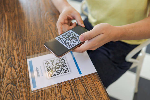 istock Qr code payment. E wallet. Man scanning tag accepted generate digital pay without money.scanning QR code online shopping cashless payment and verificationtechnology concept 1304698836