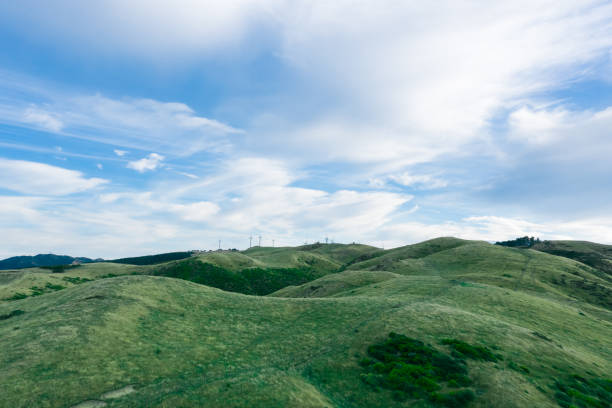 istock drone view with wind farm turbine Green Landscape 1304699346