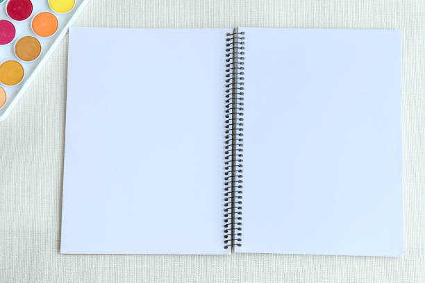 istock Top view of open blank spiral-bound notebook, realistic vector mockup 1304700985