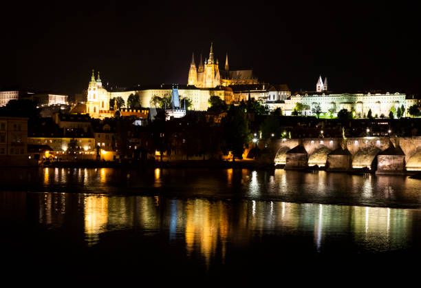 istock Prague cityscape at night with Vltava River, Czech Republic 1304705441