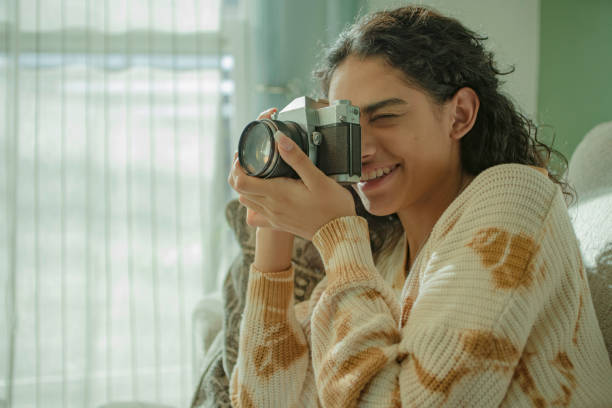 istock latin young woman taking pictures 1304707069