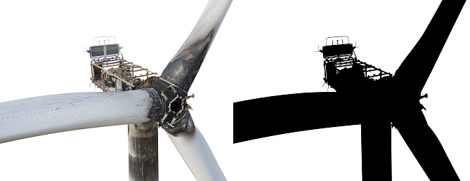Burnt wind turbine on a qualitatively isolated white background with a black mask.