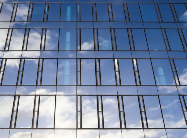 Modern office building facades with glass and reflecting sunlight in the windows