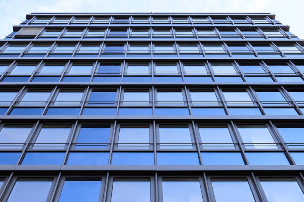 Modern office building facades with glass and reflecting sunlight in the windows