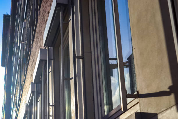 Modern office building facades with glass and reflecting sunlight in the windows