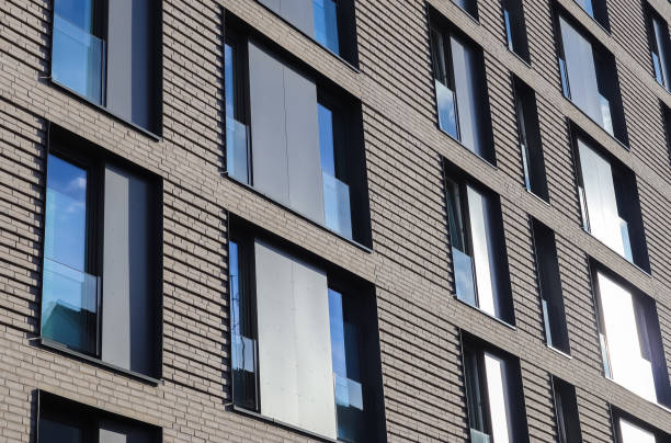 Modern office building facades with glass and reflecting sunlight in the windows