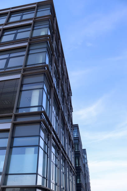 istock Modern office building facades with glass and reflecting sunlight in the windows 1304708148