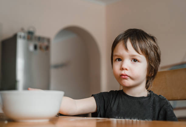 istock A little boy doesn't want to eat his breakfast 1304708189
