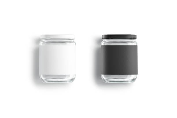 istock Blank glass jar with black and white label mockup lying 1304708785
