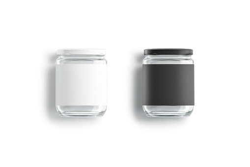 Blank glass jar with black and white label mockup lying, 3d rendering. Empty conservation transparent tin mock up, isolated, top view. Clear screw bank for canned food template.