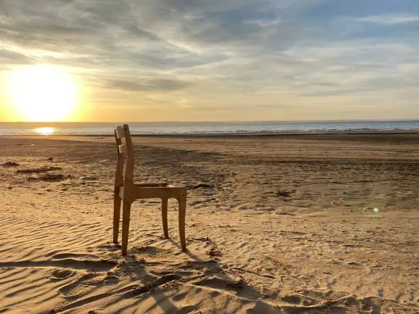 Photo of Autumn nature photo. River bank. Sunset. Lonely chair