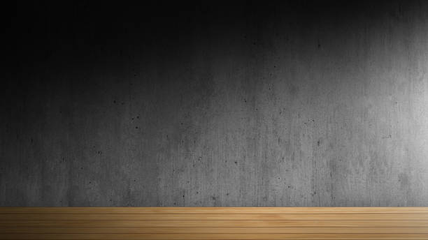 istock Wooden floor with dark concrete wall background. 1304710946