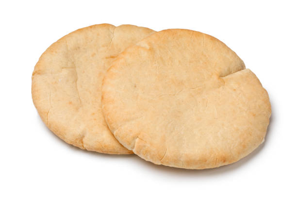 Pair of fresh baked pita bread isolated on white background Pair of fresh baked pita bread isolated on white background pita bread isolated stock pictures, royalty-free photos & images