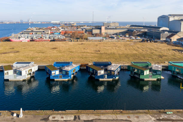 Modern houseboat next to other boats in the harbor Weiße Wiek Boltenhagen. Germany