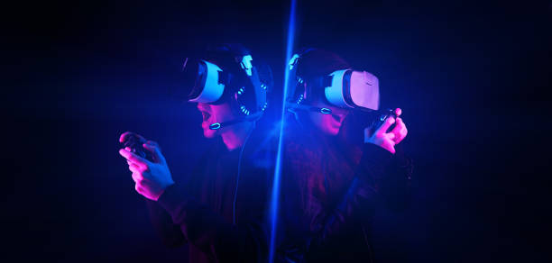 istock Gamers with virtual reality headsets and gamepads. 1304717197
